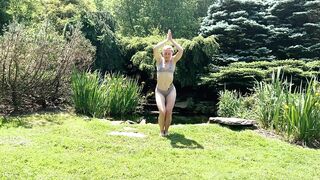 Sexy Yoga Dance Flow Woman in Bikini Lingerie by a Waterfall Pond in Nature